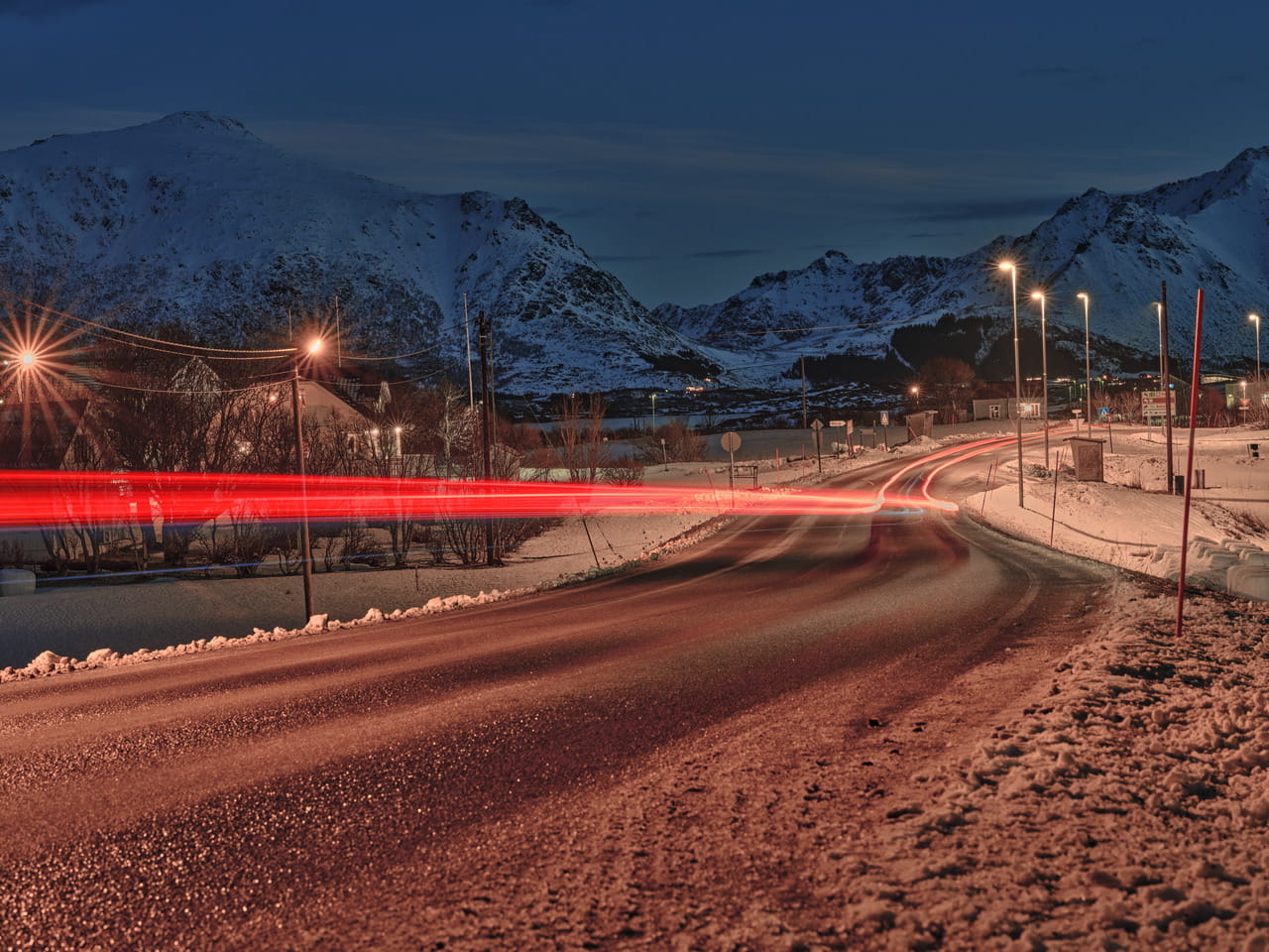 A road with mountains in the background